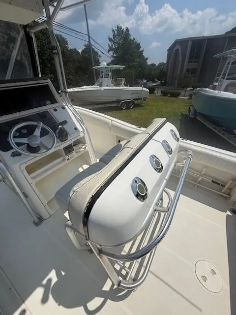 Slide: The Image of 2003 Hydra-Sports Vector 2400 CC boat interior with steering console and seating. - 4