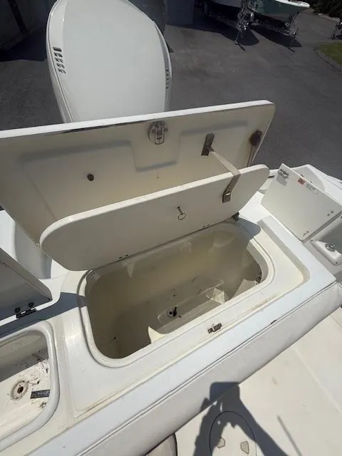Slide: The Image of Open storage compartment on a 2003 Hydra-Sports Vector 2400 CC boat. - 5