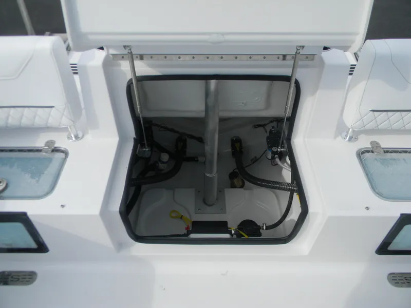 Slide: The Image of Open storage compartment on 2026 Sportsman Heritage 231 Center Console boat. - 11