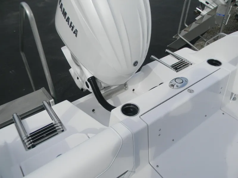 Slide: The Image of 2026 Sportsman Heritage 231 Center Console boat with Yamaha engine, featuring sleek white design. - 12