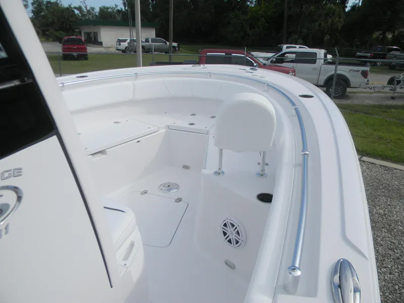 Slide: The Image of 2026 Sportsman Heritage 231 Center Console boat interior with seating and storage compartments. - 4
