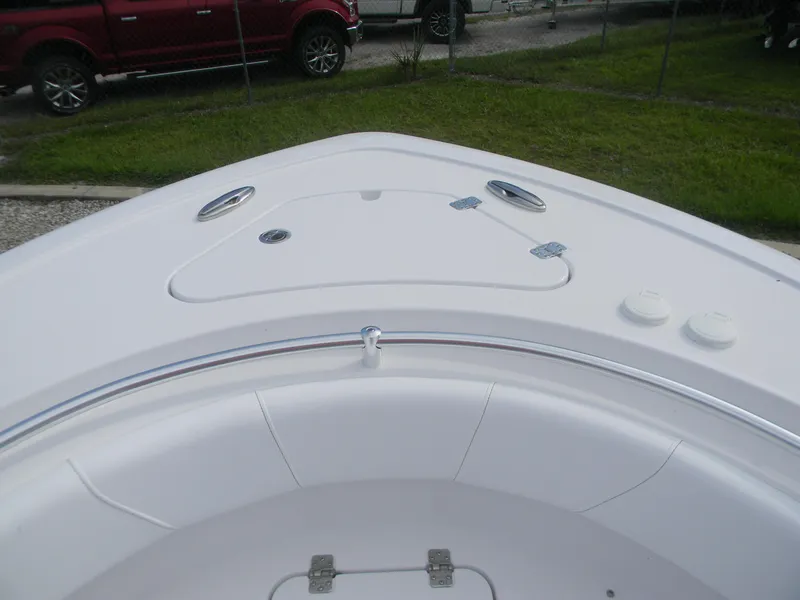 Slide: The Image of 2026 Sportsman Heritage 231 Center Console boat deck, featuring sleek design and storage compartments. - 5