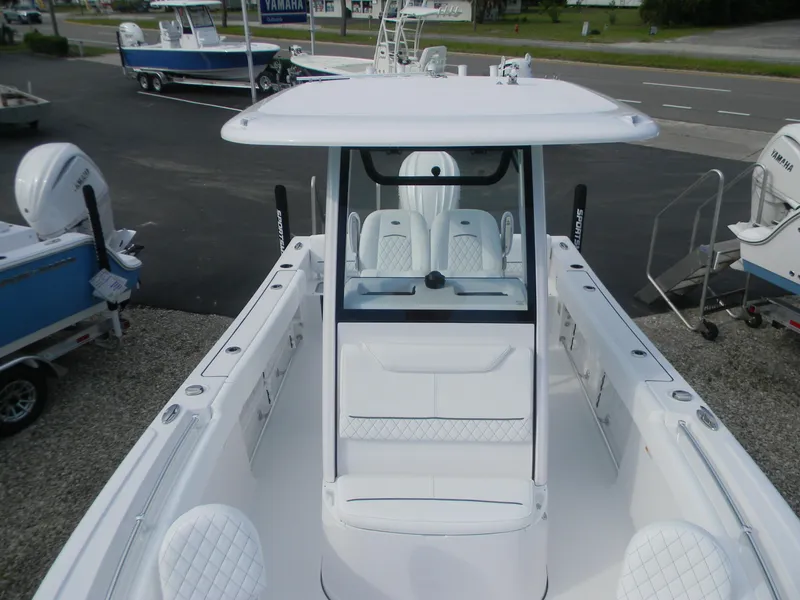 Slide: The Image of 2026 Sportsman Heritage 231 Center Console boat, featuring sleek design and spacious seating. - 6