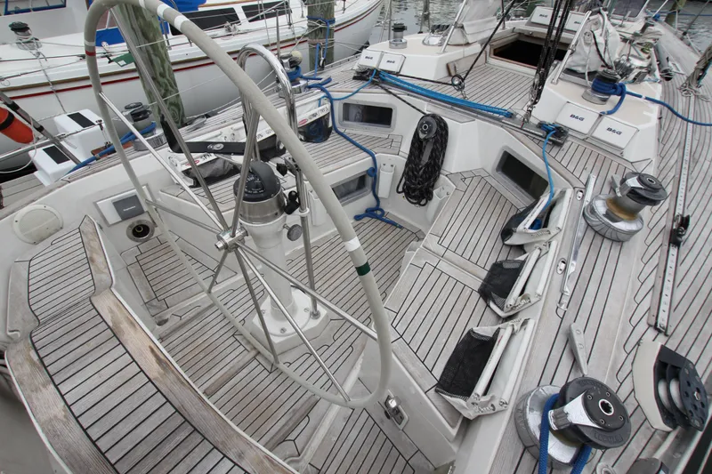 Slide: The Image of Cockpit of 1983 Baltic 38DP sailboat with wooden deck and steering wheel. - 12