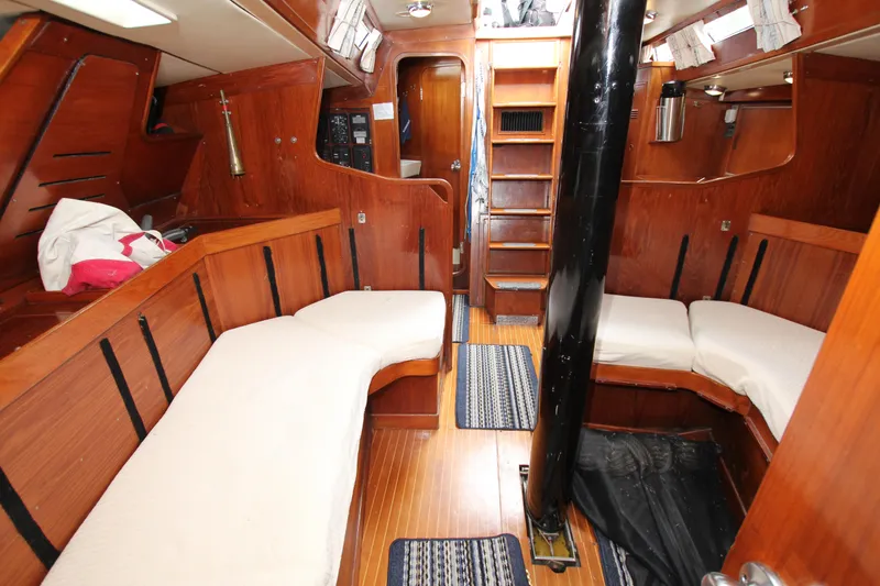 Slide: The Image of Interior of 1983 Baltic 38DP sailboat with wooden furnishings and cozy seating. - 15
