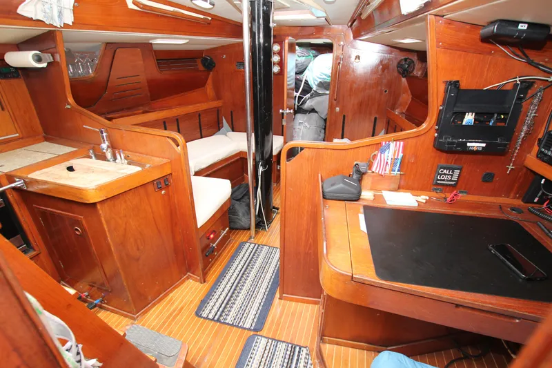 Slide: The Image of Interior of 1983 Baltic 38DP sailboat with wooden furnishings and compact layout. - 18