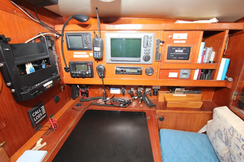 Slide: The Image of Navigation station of a 1983 Baltic 38DP yacht with communication and control equipment. - 21