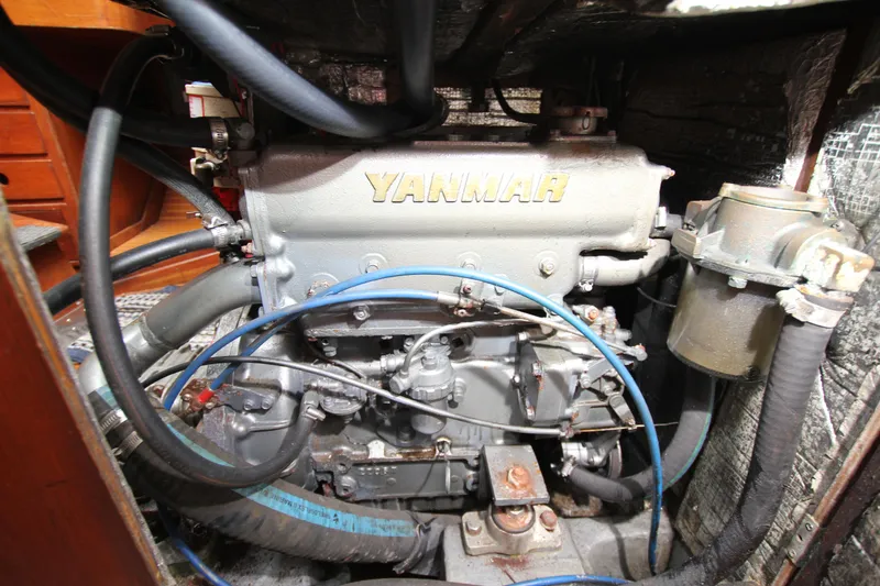 Slide: The Image of Yanmar engine in a 1983 Baltic 38DP sailboat, showcasing detailed mechanical components. - 27
