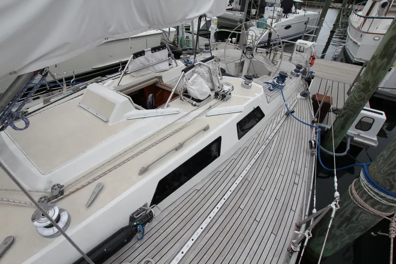 Slide: The Image of 1983 Baltic 38DP sailboat docked, showcasing deck and rigging details. - 9