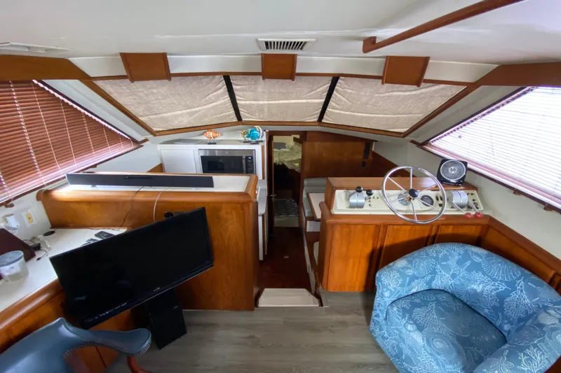 Slide: The Image of Interior of a 1990 Californian 52 yacht with helm, seating, and modern amenities. - 66