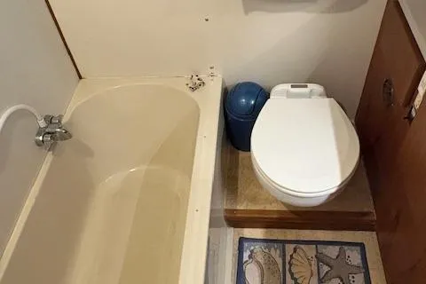 Slide: The Image of Bathroom in 1990 Carver Californian 52 yacht with bathtub and toilet. - 10