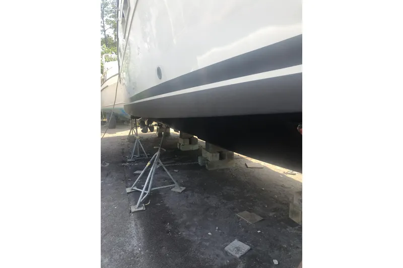 Slide: The Image of 1990 Californian 52 yacht on stands, hull view in dry dock. - 11