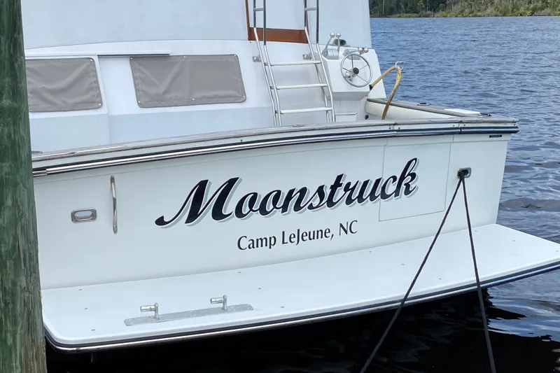 Slide: The Image of Californian 52 yacht "Moonstruck" docked at Camp Lejeune, NC, 1990 model. - 2