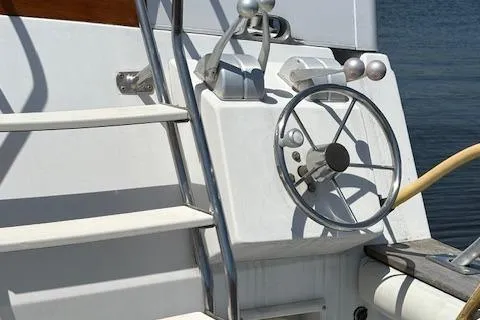 Slide: The Image of 1990 Carver Californian 52 yacht helm with steering wheel and controls. - 3