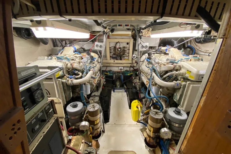Slide: The Image of Engine room of a 1990 Californian 52 yacht, showcasing complex machinery and equipment. - 41