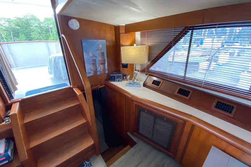 Slide: The Image of Interior of a 1990 Californian 52 yacht with wooden stairs and nautical decor. - 62