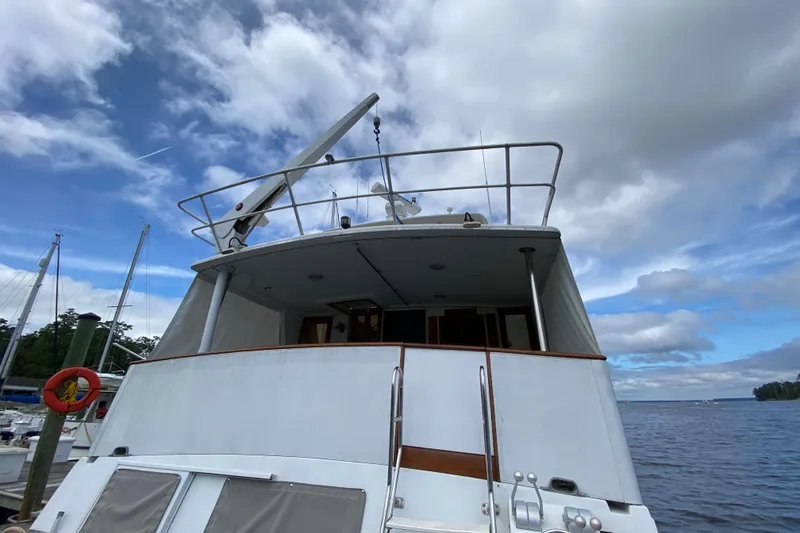 Slide: The Image of Californian 52 yacht from 1990 docked under a cloudy sky. - 7