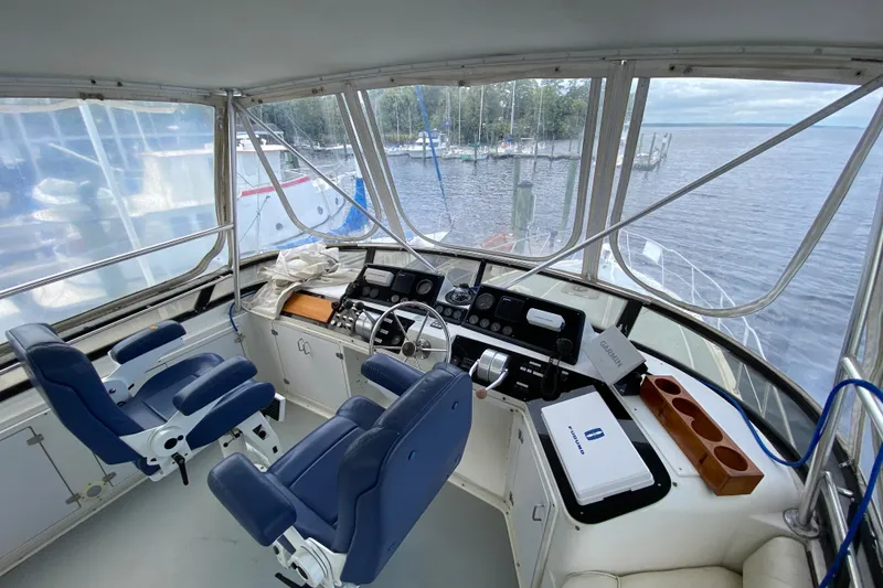 Slide: The Image of Cockpit of 1990 Californian 52 yacht with blue seats and navigation equipment. - 26
