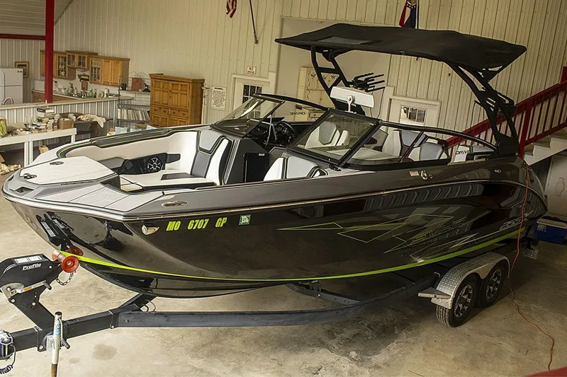 Slide: The Image of 2021 Yamaha Boats 255XD dashboard with illuminated controls and touchscreen display. - 21