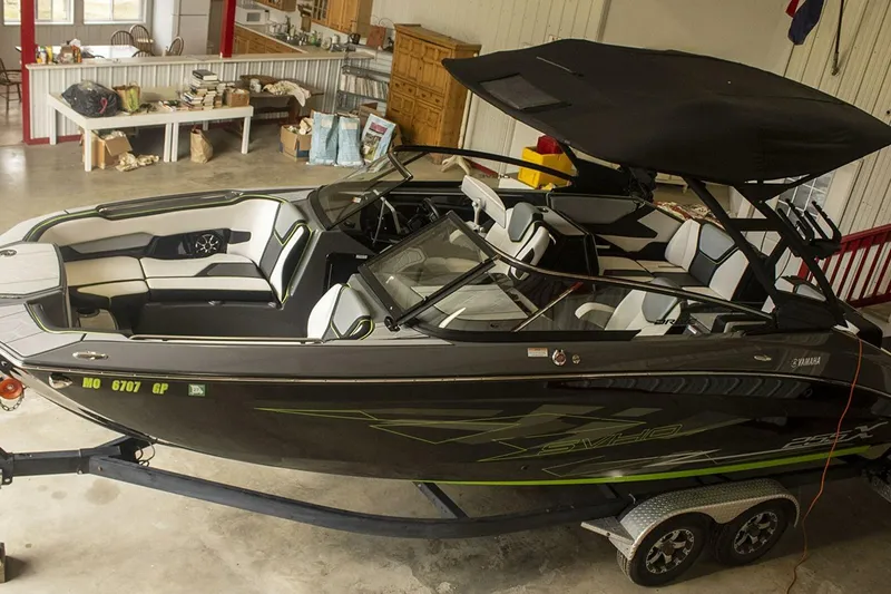 Slide: The Image of Steering console of 2021 Yamaha Boats 255XD with touchscreen and controls. - 22