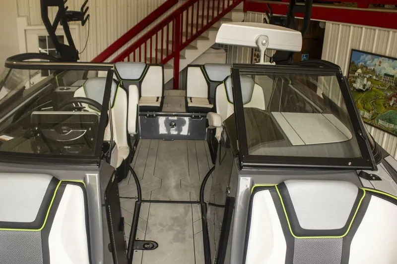 Slide: The Image of Yamaha Boats 255XD 2021 dashboard with illuminated controls and touchscreen display. - 23