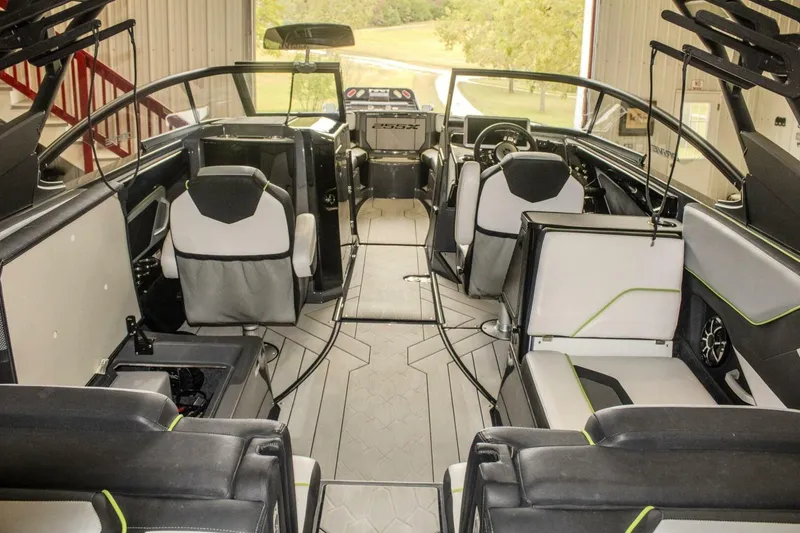 Slide: The Image of Close-up of Yamaha Boats 255XD 2021 engine components on concrete surface. - 33