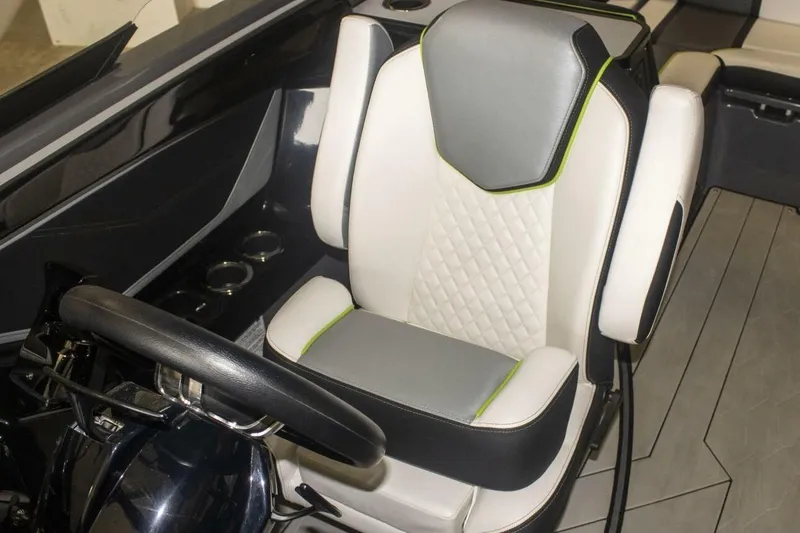 Slide: The Image of Engine components of a 2021 Yamaha Boats 255XD, featuring hoses and connectors. - 36