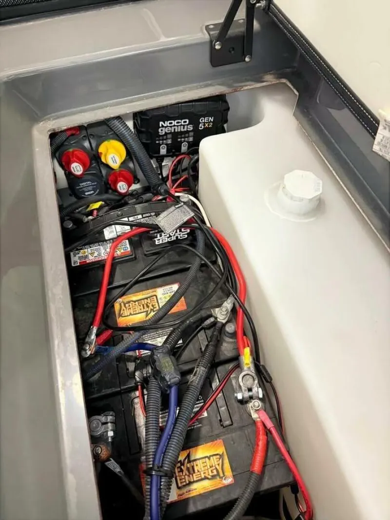 Slide: The Image of 2021 Yamaha Boats 255XD in a garage, front view with trailer. - 4