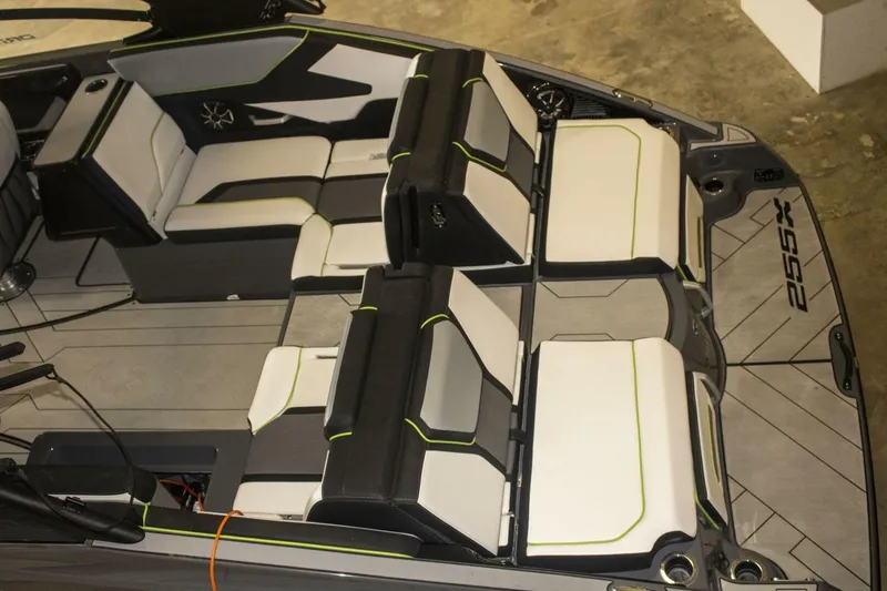 Slide: The Image of 2021 Yamaha Boats 255XD interior view, showcasing storage compartments and seating details. - 45