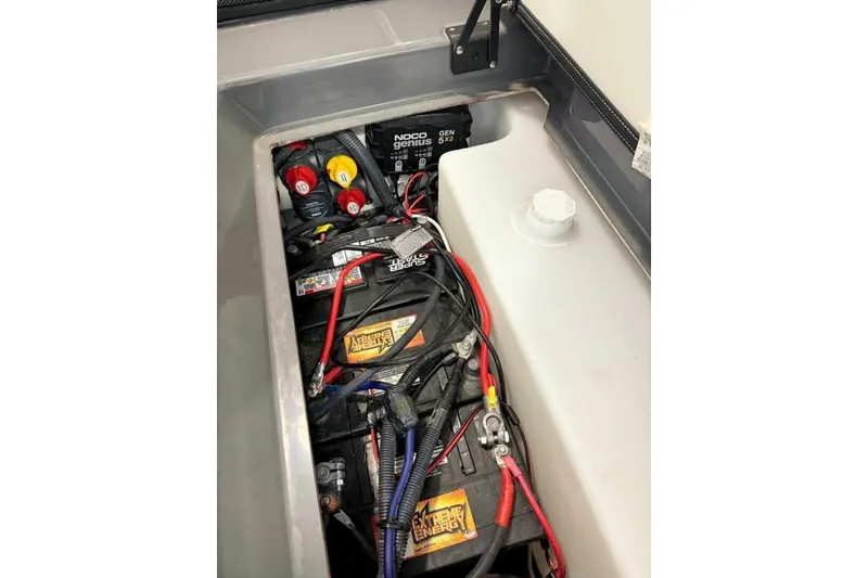 Slide: The Image of 2021 Yamaha Boats 255XD interior storage compartment with sleek design and durable materials. - 46