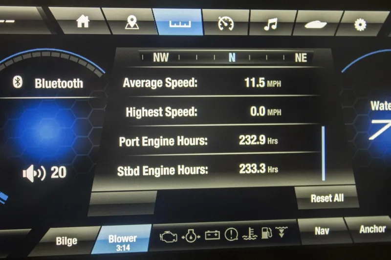 Slide: The Image of 2021 Yamaha Boats 255XD storage compartment with netting and sleek black finish. - 47