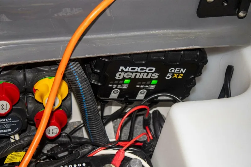 Slide: The Image of 2021 Yamaha Boats 255XD interior storage compartment with netting and sleek design. - 48