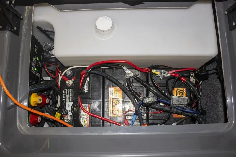 Slide: The Image of 2021 Yamaha Boats 255XD interior with cup holder and speaker detail. - 49