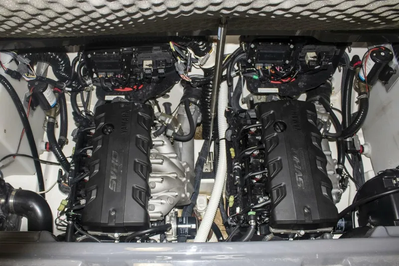 Slide: The Image of 2021 Yamaha Boats 255XD dashboard with touchscreen, steering wheel, and control panel. - 52