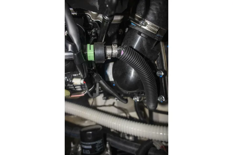 Slide: The Image of Close-up of 2021 Yamaha Boats 255XD model logo on sleek black surface. - 53