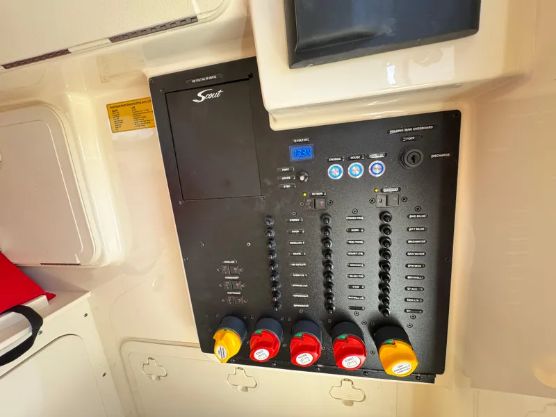 Slide: The Image of Control panel of 2024 Scout 277 LXF boat with labeled switches and indicators. - 34