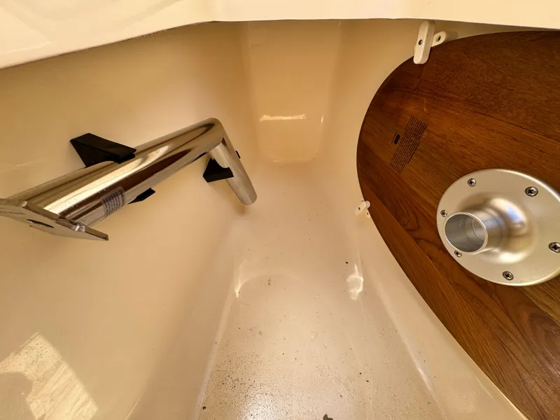 Slide: The Image of Interior view of 2024 Scout 277 LXF boat, featuring stainless steel and wood accents. - 35