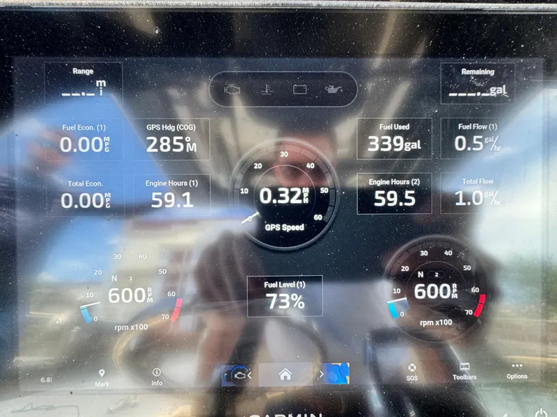 Slide: The Image of 2024 Scout 277 LXF dashboard display showing fuel, engine hours, and GPS data. - 36