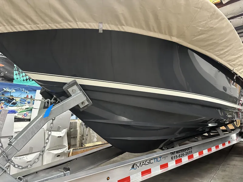 Slide: The Image of 2024 Scout 277 LXF boat on trailer, covered and ready for transport. - 37