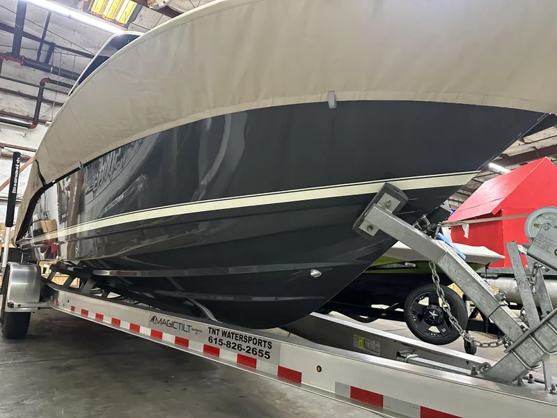 Slide: The Image of 2024 Scout 277 LXF boat on trailer in indoor storage facility. - 38