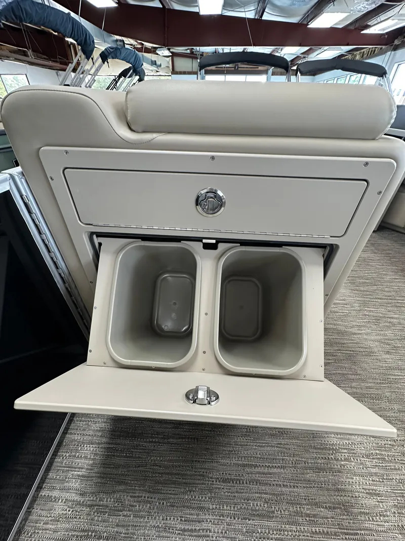 Slide: The Image of 2025 Godfrey Sweetwater 2086 SBC boat storage compartment with dual bins. - 10