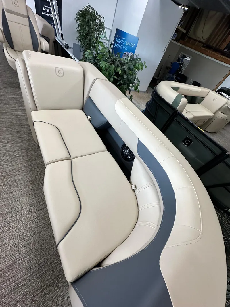 Slide: The Image of Luxurious seating on 2025 Godfrey Sweetwater 2086 SBC pontoon boat, featuring elegant beige upholstery. - 12