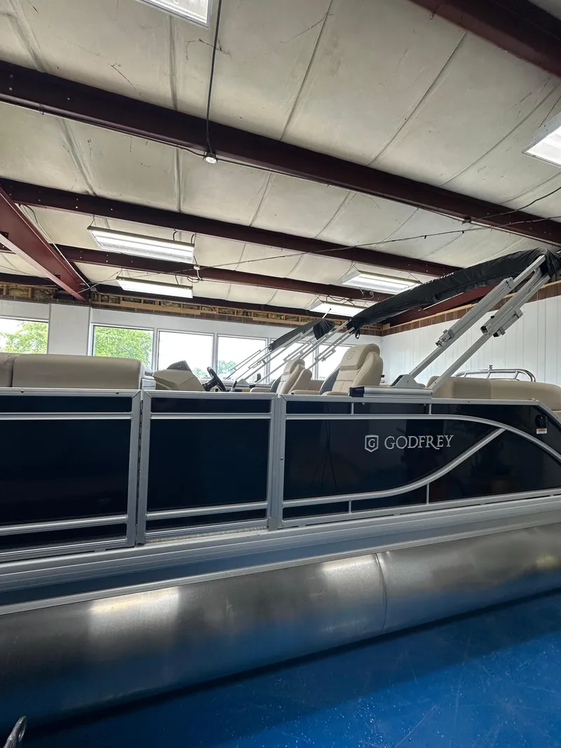 Slide: The Image of 2025 Godfrey Sweetwater 2086 SBC pontoon boat in indoor showroom. - 14