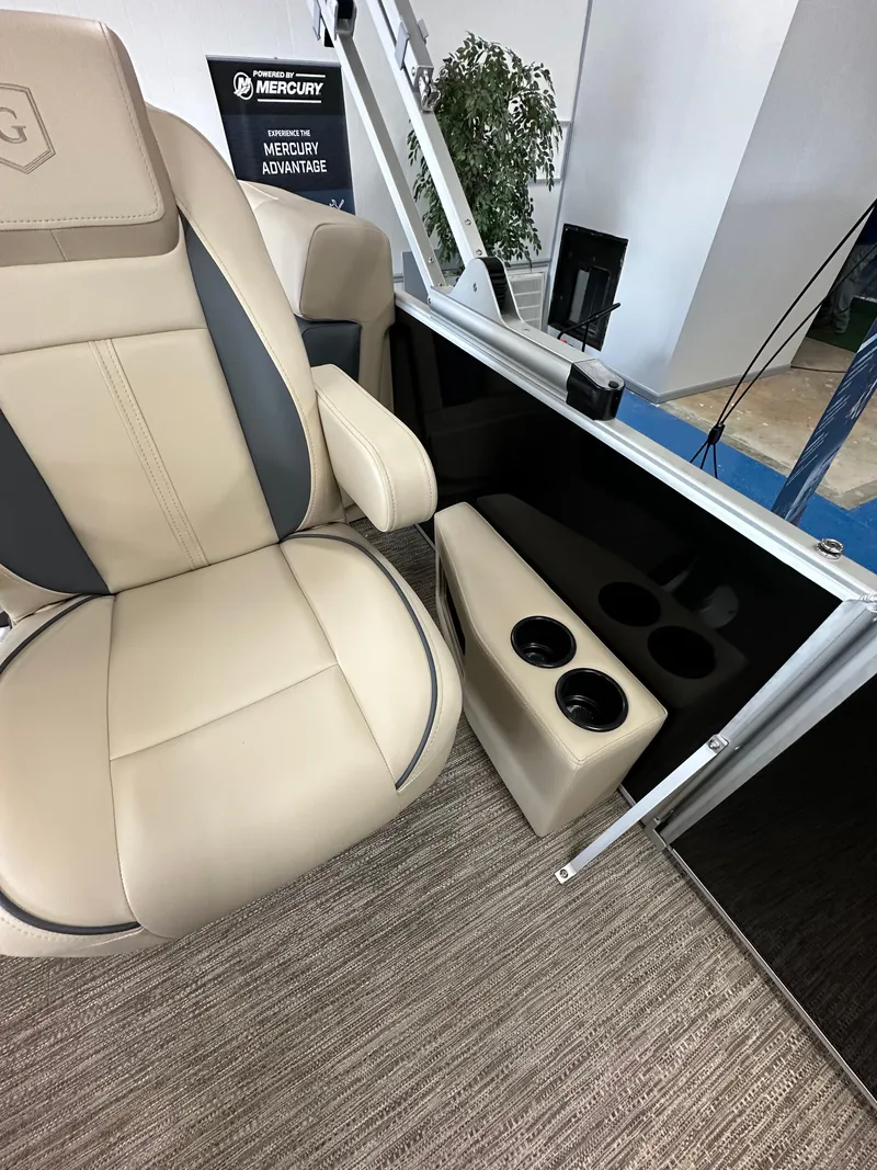 Slide: The Image of Beige seating and cup holders on 2025 Godfrey Sweetwater 2086 SBC boat interior. - 9