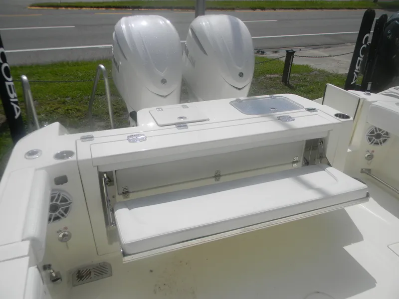 Slide: The Image of 2025 Cobia 285 Center Console boat with dual engines and foldable seating. - 20