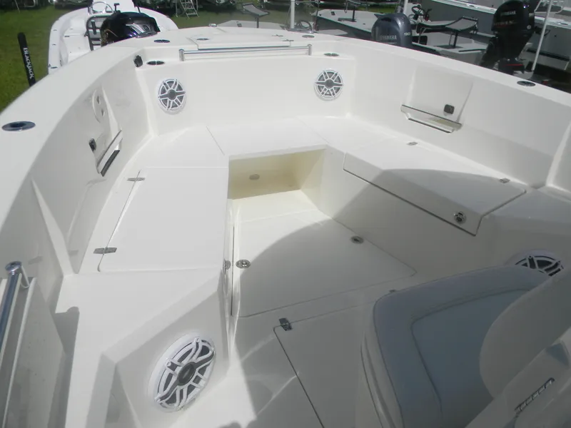Slide: The Image of 2025 Cobia 285 Center Console boat interior with seating and storage compartments. - 21