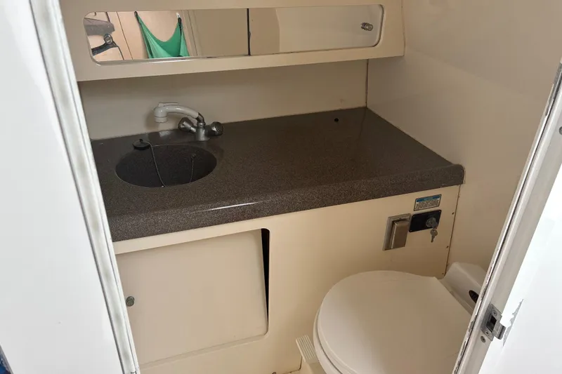 Slide: The Image of Interior of 2000 Boston Whaler 28 Conquest with sink and toilet. - 11