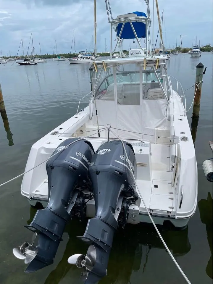 Slide: The Image of Boston Whaler 28 Conquest 2000 with Yamaha engines docked. - 13