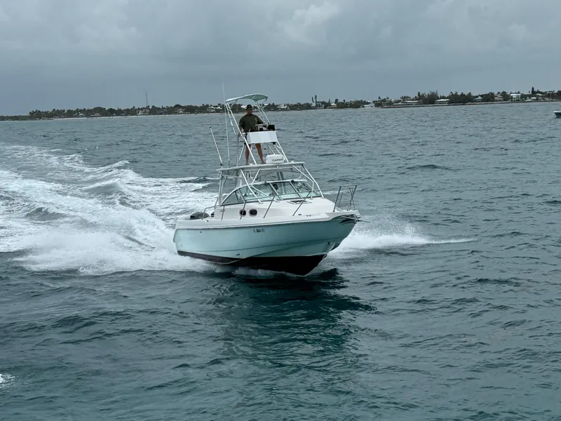 Slide: The Image of Boston Whaler 28 Conquest 2000 cruising on choppy waters. - 4