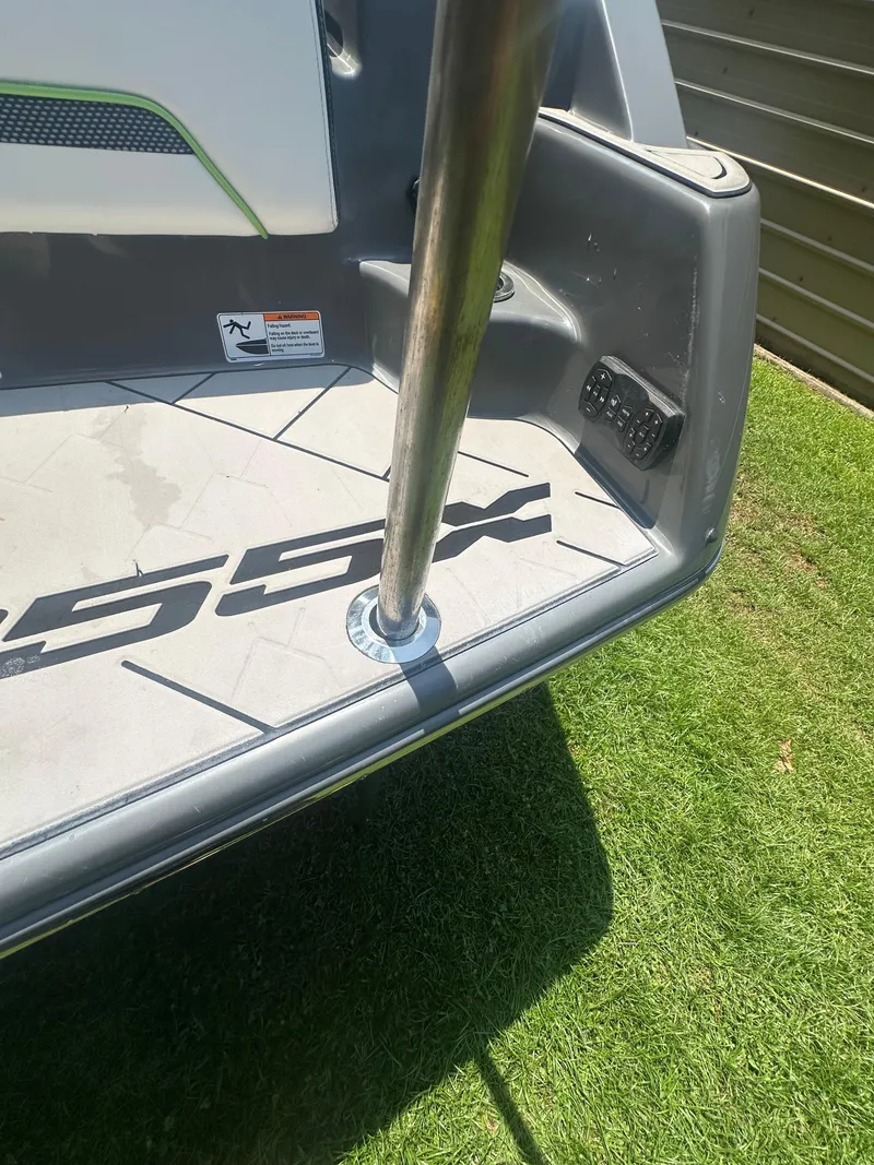 Slide: The Image of 2021 Yamaha Boats 255XD swim platform with pole, on grass. - 20